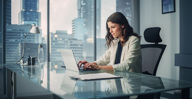woman at desk on computer